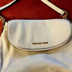 Michael Kors hobo style purse.Does have a small ink mark under the top flap.